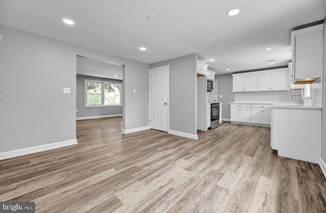 525 Mountain Road Dillsburg, PA 17019 - Photo 40 of 53 a view of a kitchen with a fridge and wooden floor