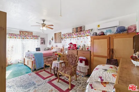 a bed room with furniture and a table
