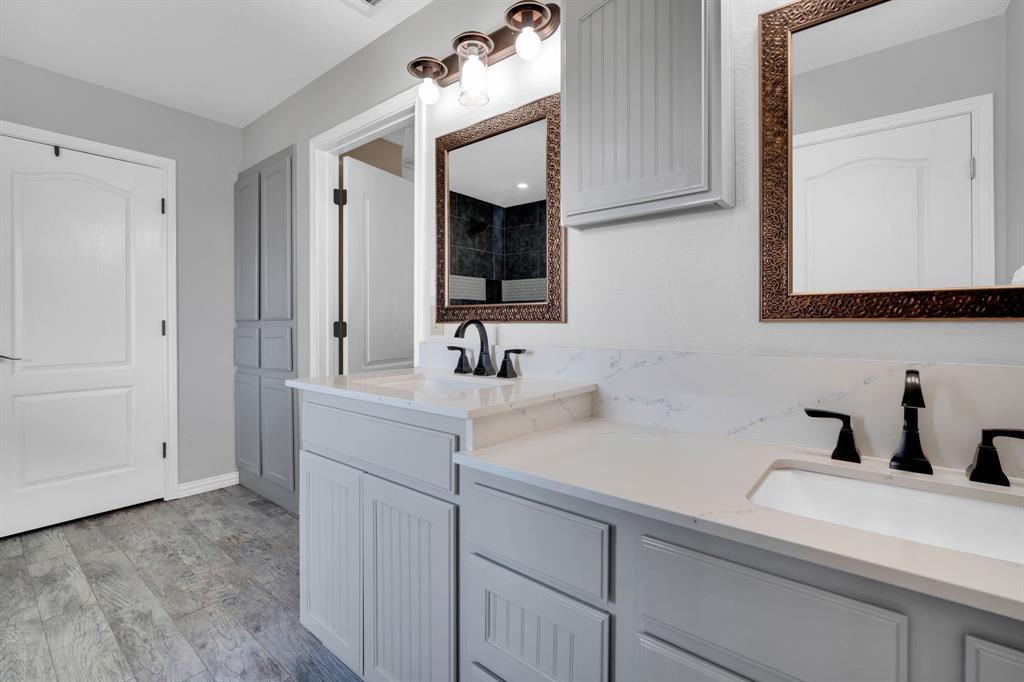 130 Eubanks Road Maypearl, TX 76064 - Photo 15 of 39 a bathroom with a sink and a mirror