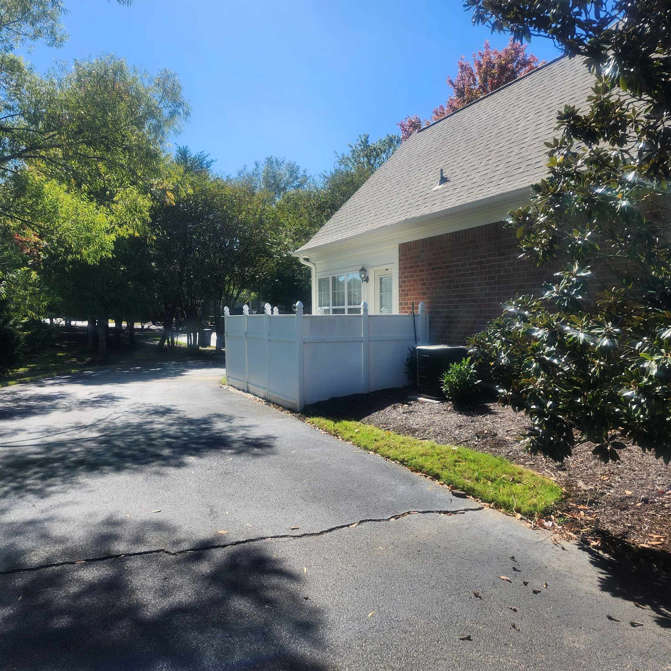 1497 Castle Pines Circle, Unit 18 Collierville, TN 38017 - Photo 21 of 23 View of home's exterior with brick siding and roof with shingles
