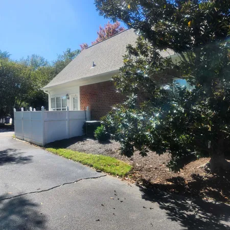a view of a house with a tree