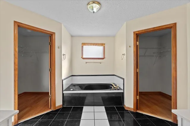 a bathroom with a sink toilet vanity and shower