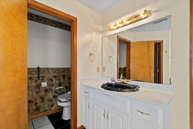 a picture of a bathroom with a shower