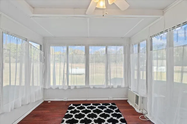 a bathroom with a black and white checkered floor