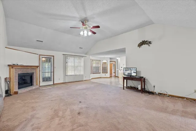 a kitchen with stainless steel appliances granite countertop a stove and a refrigerator