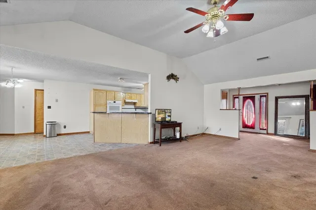 a view of a chandelier in big room and a chandelier