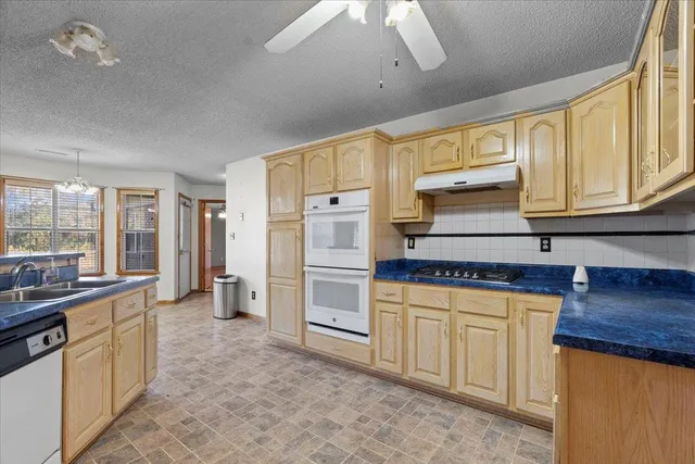 a view of a storage & utility room with a sink