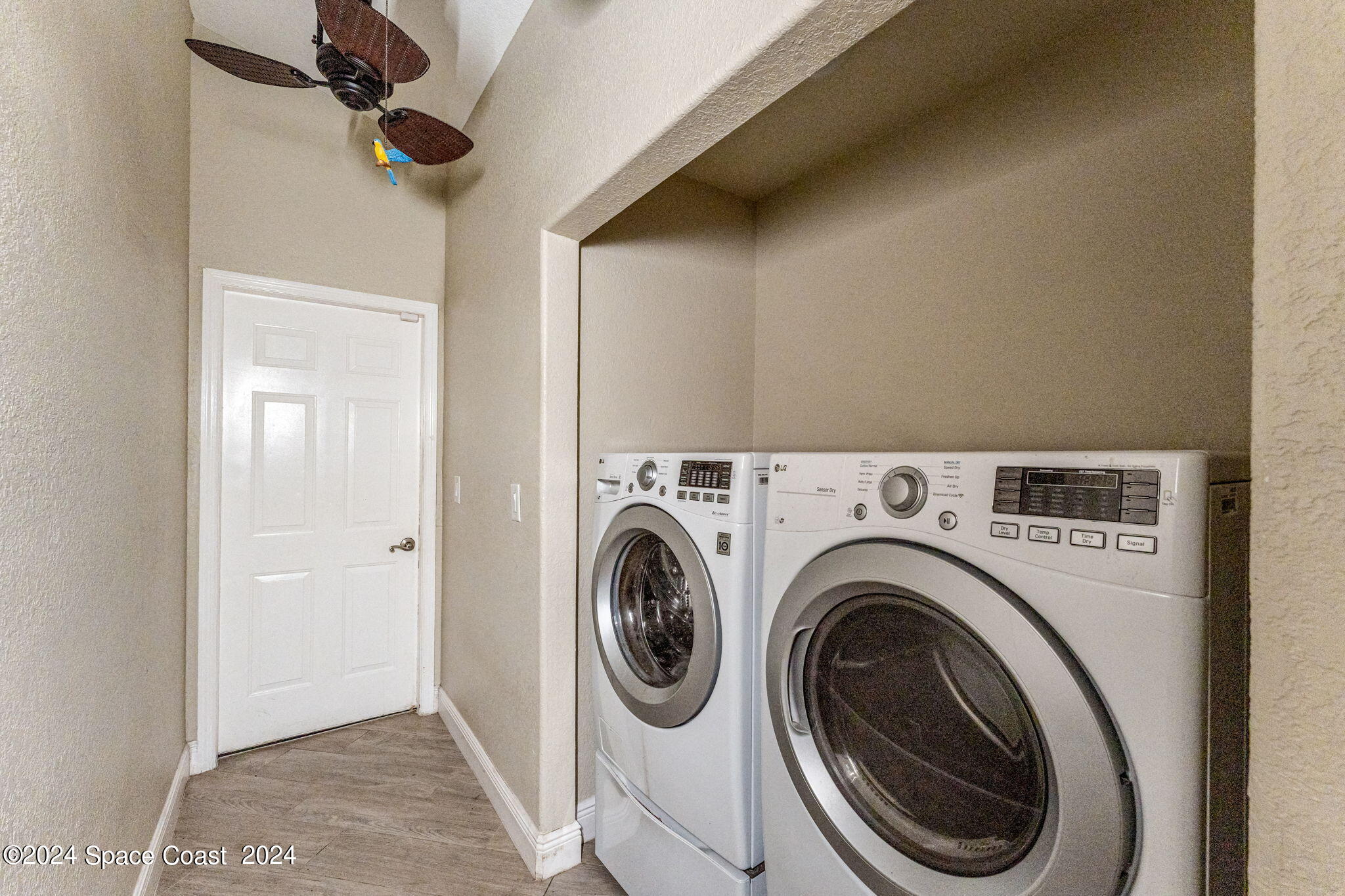 431 Nina Road Northeast Palm Bay, FL 32907 - Photo 22 of 41 a view of a hallway with washer and dryer