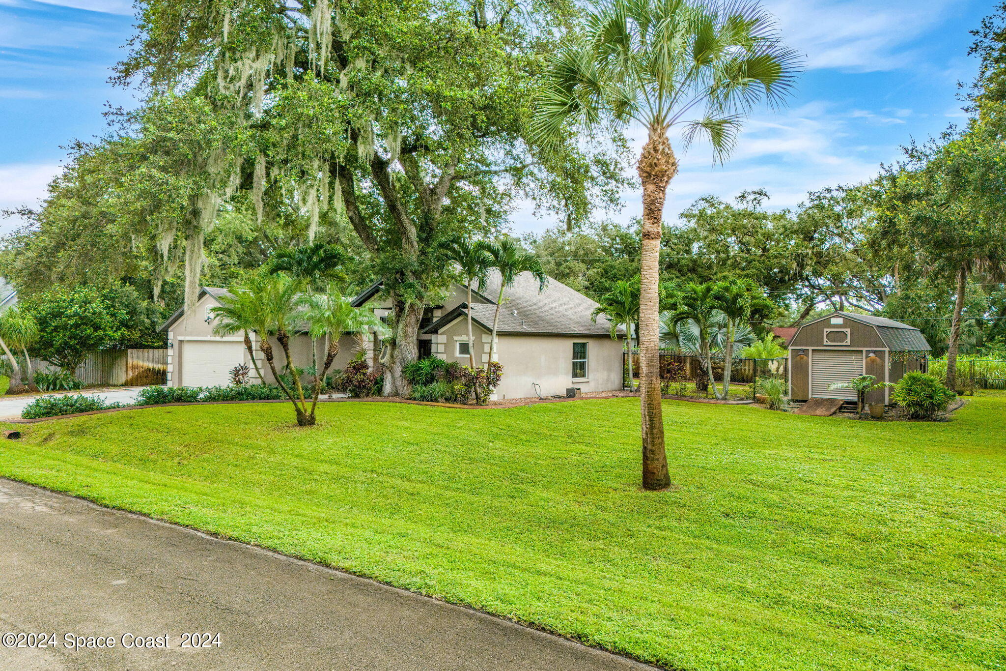 431 Nina Road Northeast Palm Bay, FL 32907 - Photo 35 of 41 a view of a house with a yard