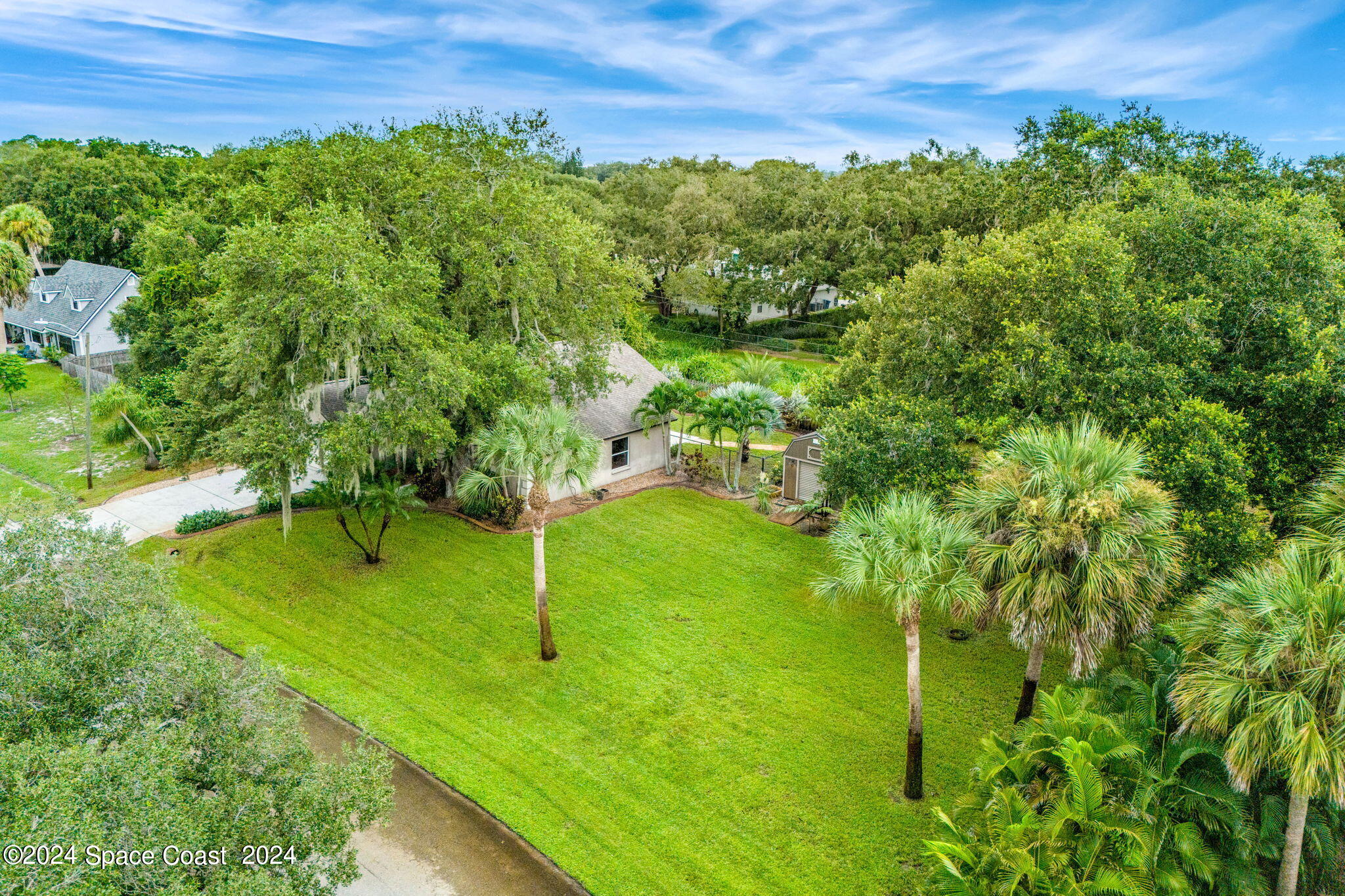 431 Nina Road Northeast Palm Bay, FL 32907 - Photo 41 of 41 a view of a lush green yard