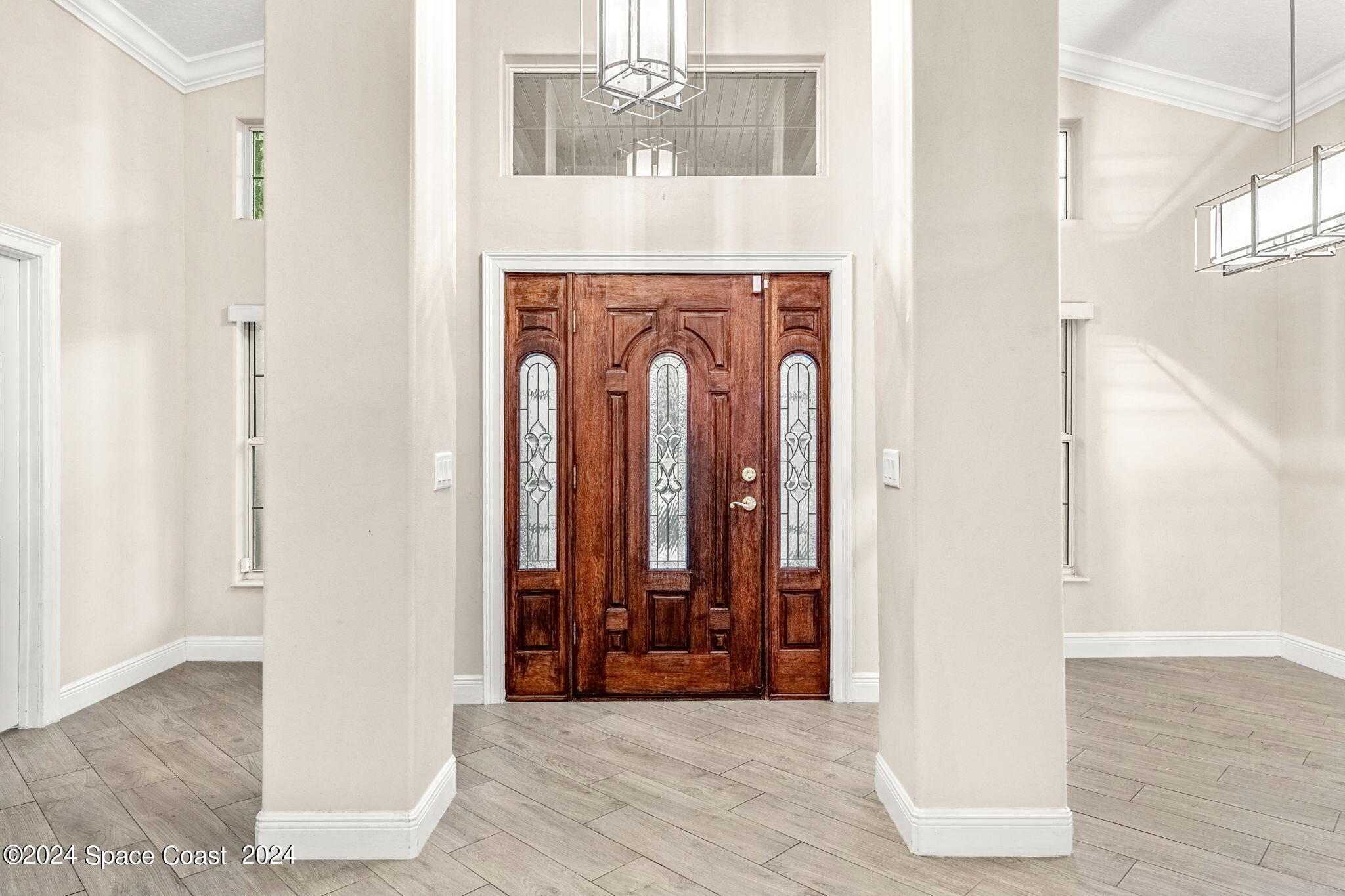 431 Nina Road Northeast Palm Bay, FL 32907 - Photo 5 of 41 a view of an entryway with wooden floor