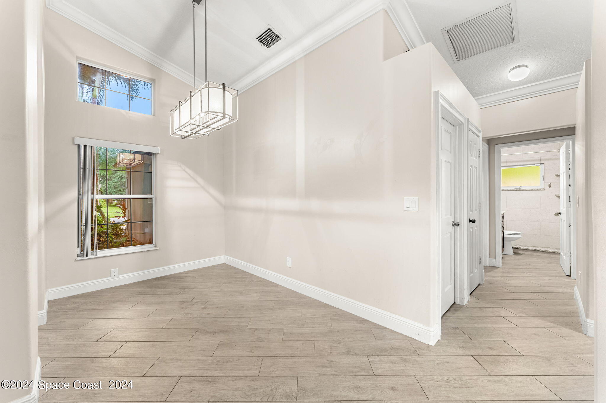 431 Nina Road Northeast Palm Bay, FL 32907 - Photo 9 of 41 a view of an empty room with a window