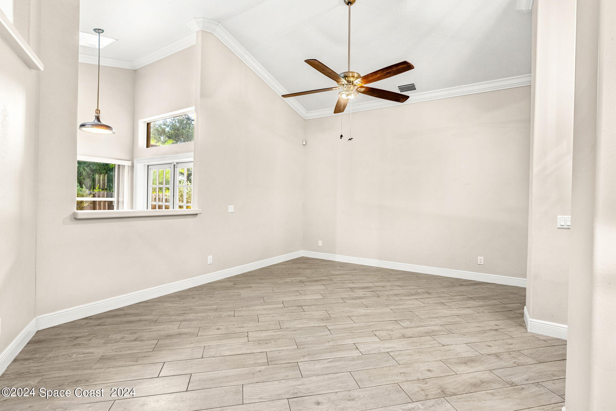 431 Nina Road Northeast Palm Bay, FL 32907 - Photo 10 of 41 a view of an empty room with a window