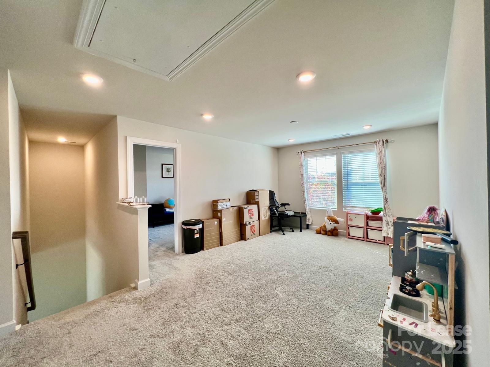 11509 Corleone Street Huntersville, NC 28078 - Photo 15 of 21 a large room with lots of gym equipment