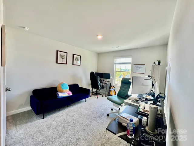 a room with furniture and a wooden floor