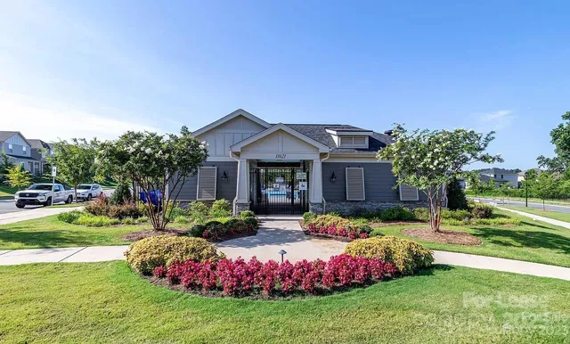 a front view of a house with garden