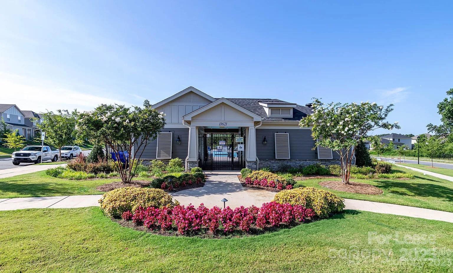 11509 Corleone Street Huntersville, NC 28078 - Photo 20 of 21 a front view of a house with garden