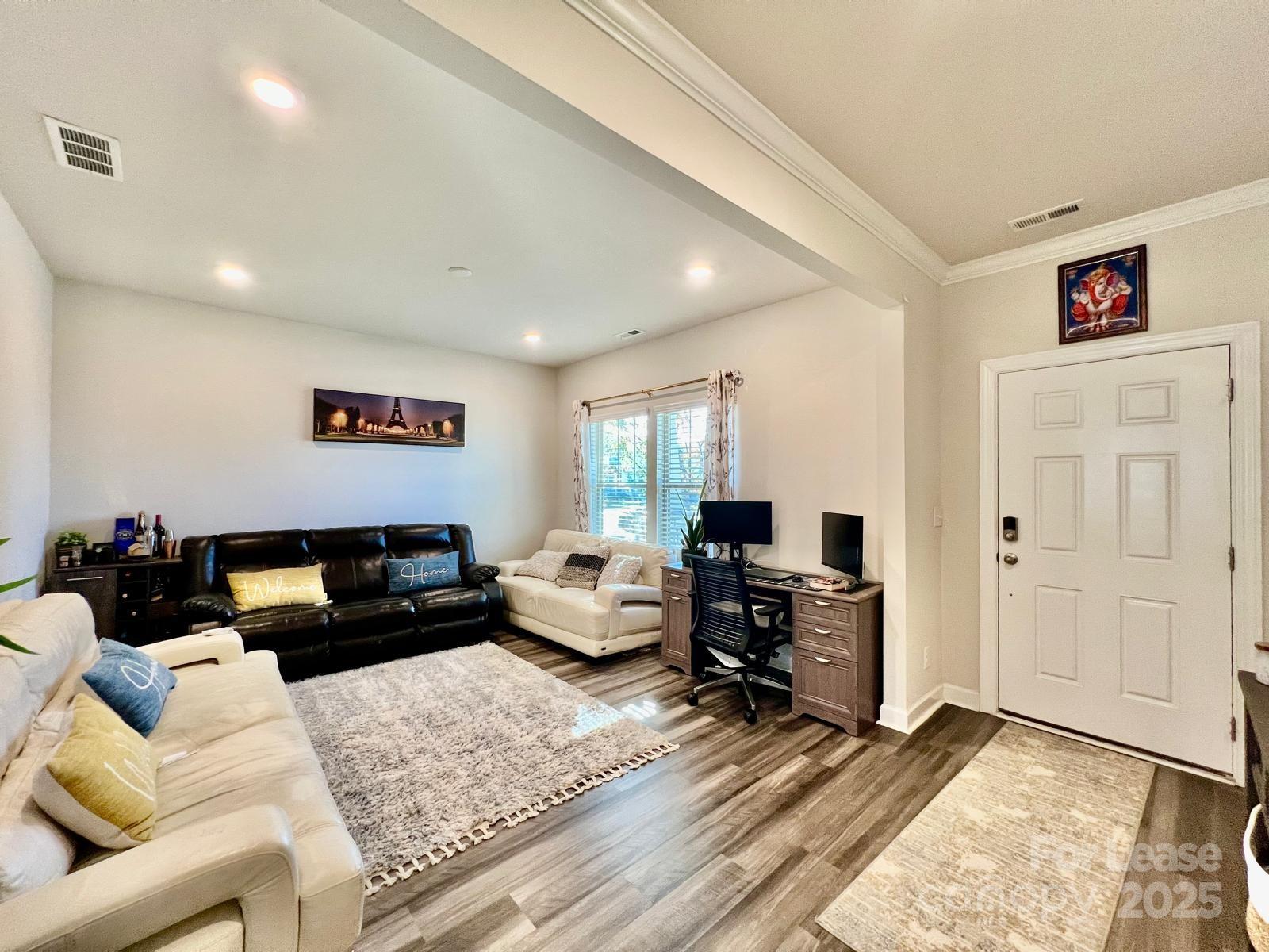 11509 Corleone Street Huntersville, NC 28078 - Photo 2 of 21 a living room with furniture and wooden floor