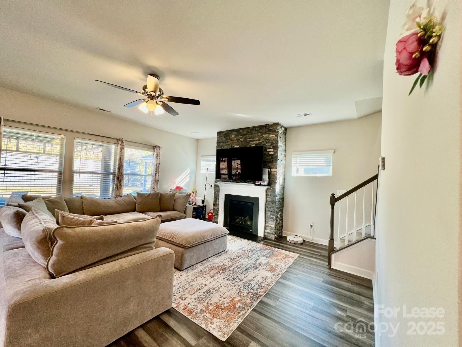 11509 Corleone Street Huntersville, NC 28078 - Photo 3 of 21 a living room with furniture fireplace and flat screen tv