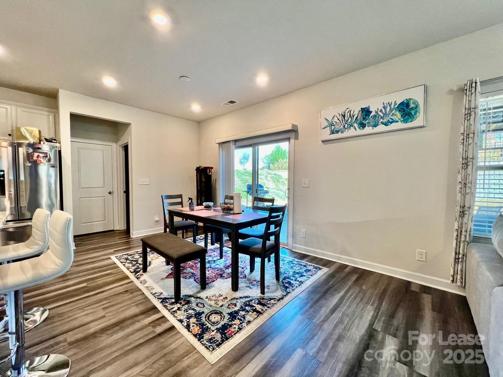 11509 Corleone Street Huntersville, NC 28078 - Photo 7 of 21 a living room with furniture and a wooden floor
