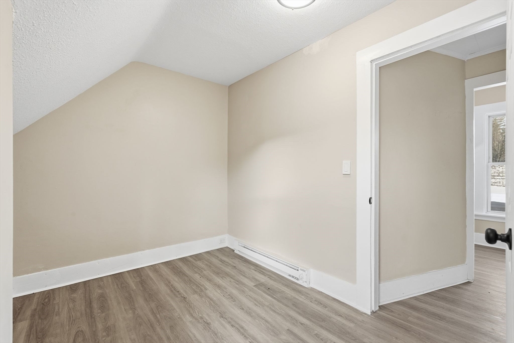 62 East Main Street Erving, MA 01344 - Photo 17 of 23 a view of an empty room with wooden floor