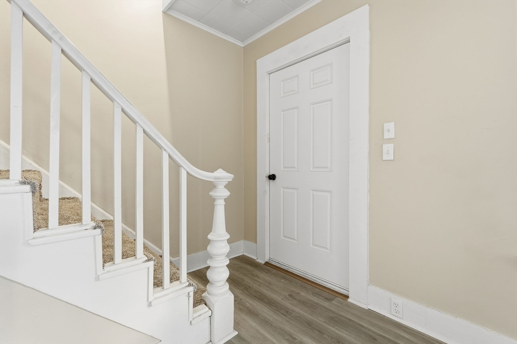 62 East Main Street Erving, MA 01344 - Photo 4 of 23 a view of staircase with white walls and a window