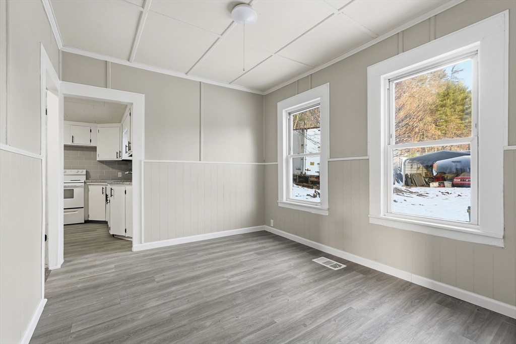62 East Main Street Erving, MA 01344 - Photo 6 of 23 wooden floor in an empty room with a window