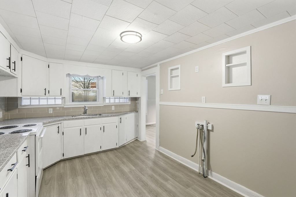 62 East Main Street Erving, MA 01344 - Photo 9 of 23 a spacious bathroom with a granite countertop sink and a mirror