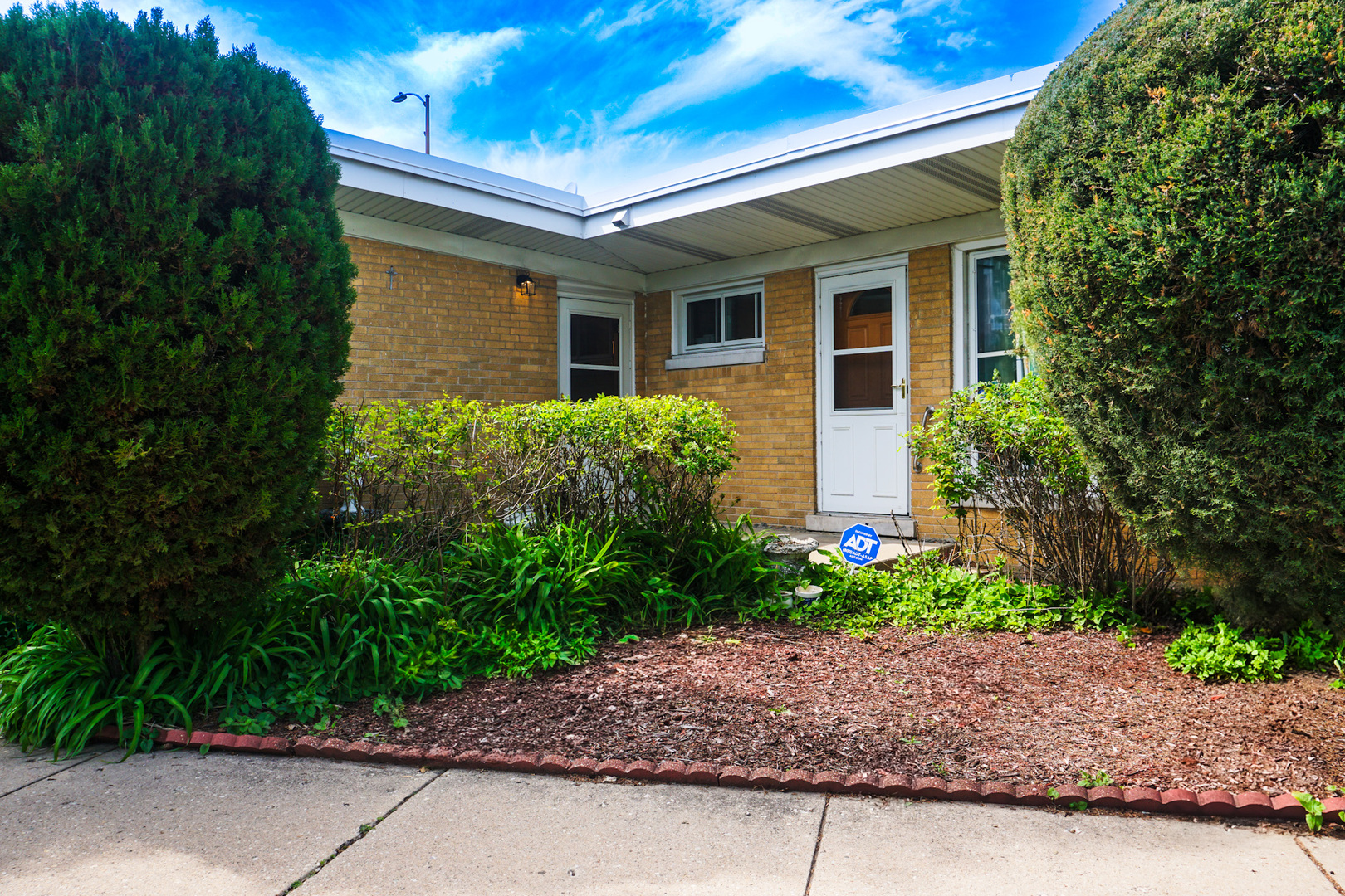 5805 North Harlem Avenue Chicago, IL 60631 - Photo 1 of 23 a view of a house with a yard and plants
