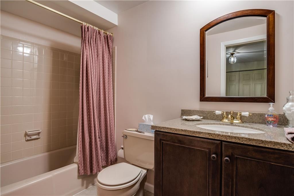 9371 Hilliard Road Pittsburgh, PA 15237 - Photo 19 of 22 THE HALL BATH WAS UPDATED WITH NEW CABINETRY AND GRANITE IN 2017.