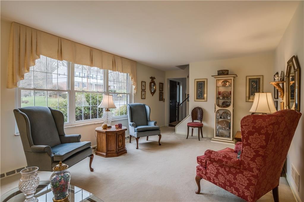 9371 Hilliard Road Pittsburgh, PA 15237 - Photo 10 of 22 THIS SUNNY LIVING ROOM HAS HARDWOOD BENEATH THE CARPETING AND MEASURES 20X12