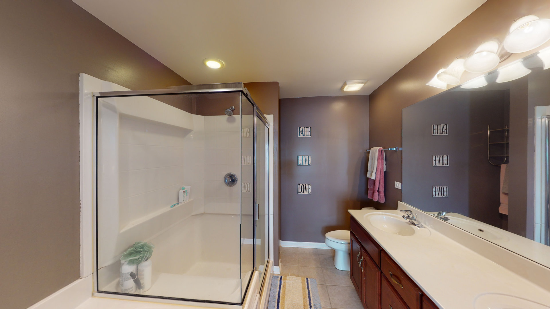 716 Prescott Court Naperville, IL 60563 - Photo 12 of 21 a bathroom with a sink mirror vanity and toilet