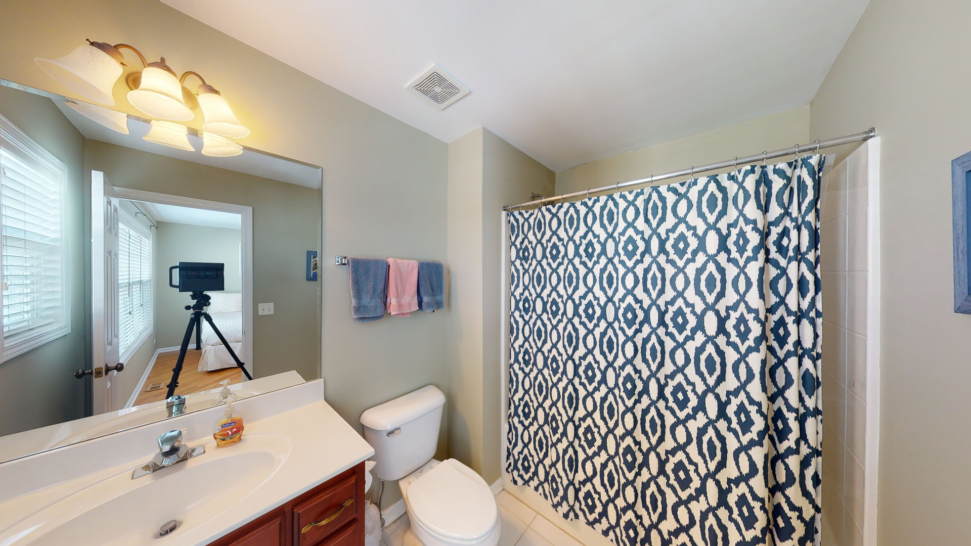 716 Prescott Court Naperville, IL 60563 - Photo 15 of 21 a bathroom with a sink and a mirror