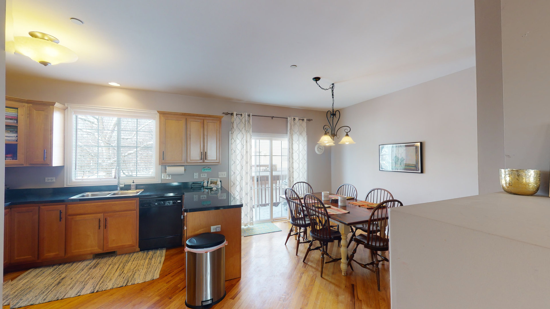 716 Prescott Court Naperville, IL 60563 - Photo 4 of 21 a view of a dining room with furniture and wooden floor