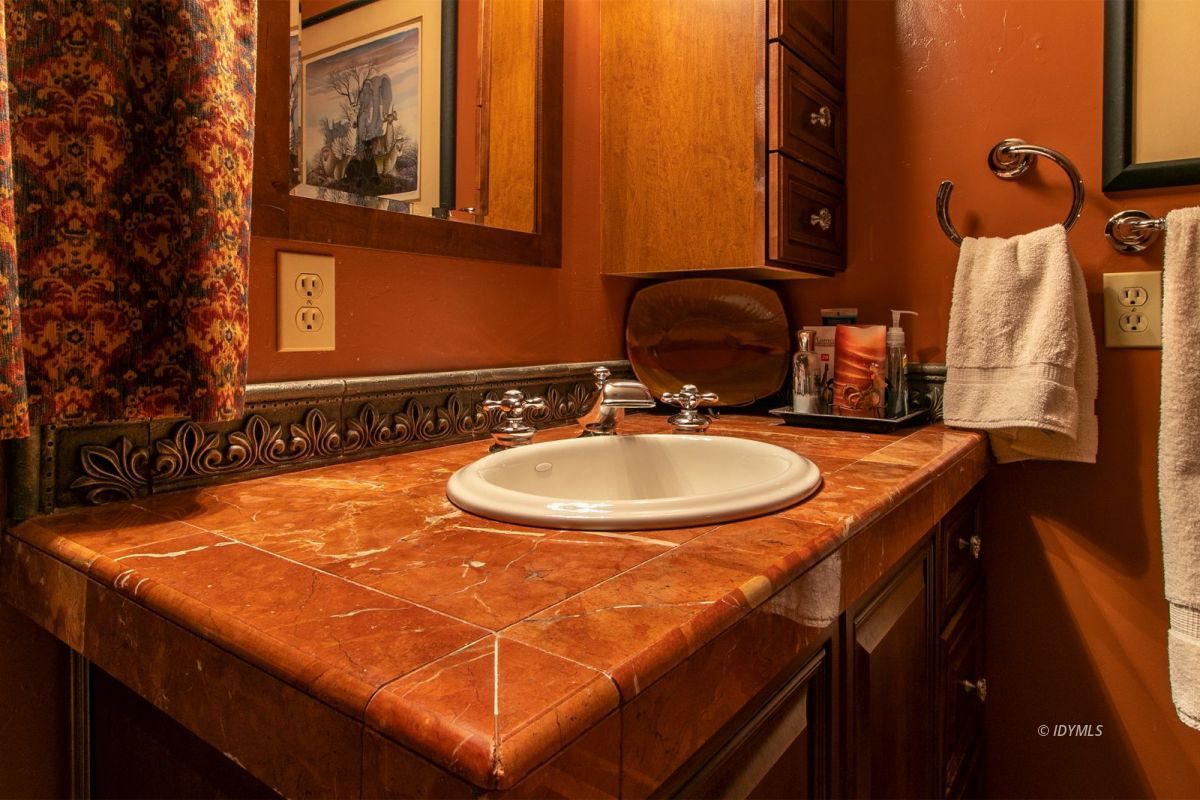24715 Upper Rim Rock Road Idyllwild, CA 92549 - Photo 33 of 64 a bathroom with a sink and a mirror