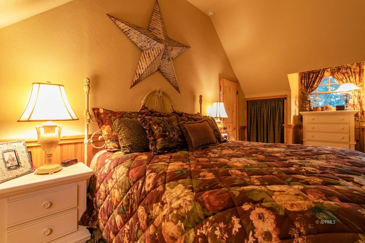 24715 Upper Rim Rock Road Idyllwild, CA 92549 - Photo 39 of 64 a bed sitting in a bedroom next to a window