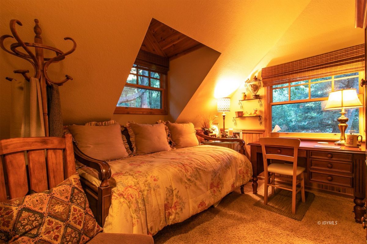 24715 Upper Rim Rock Road Idyllwild, CA 92549 - Photo 45 of 64 a bedroom with a bed and a window