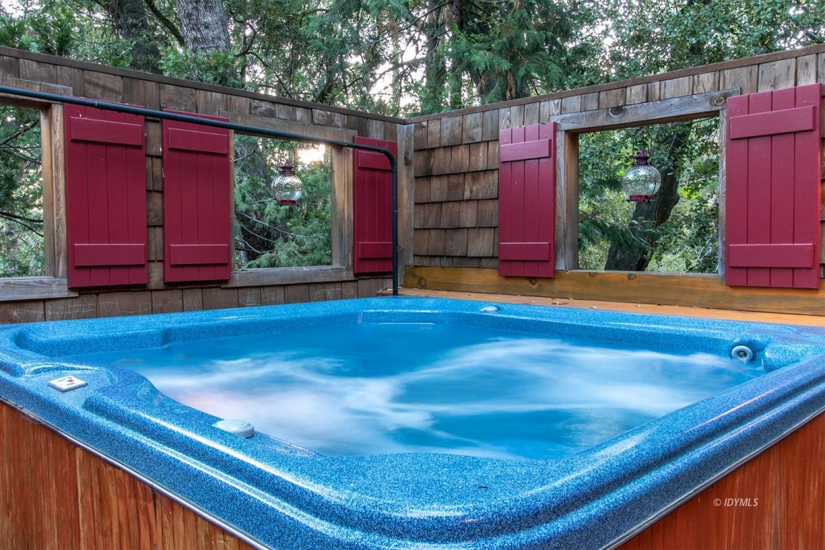 24715 Upper Rim Rock Road Idyllwild, CA 92549 - Photo 53 of 64 a view of a pool with red chairs in front of it