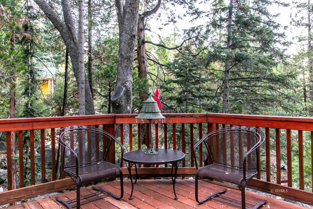 24715 Upper Rim Rock Road Idyllwild, CA 92549 - Photo 56 of 64 a view of a two chairs in the deck