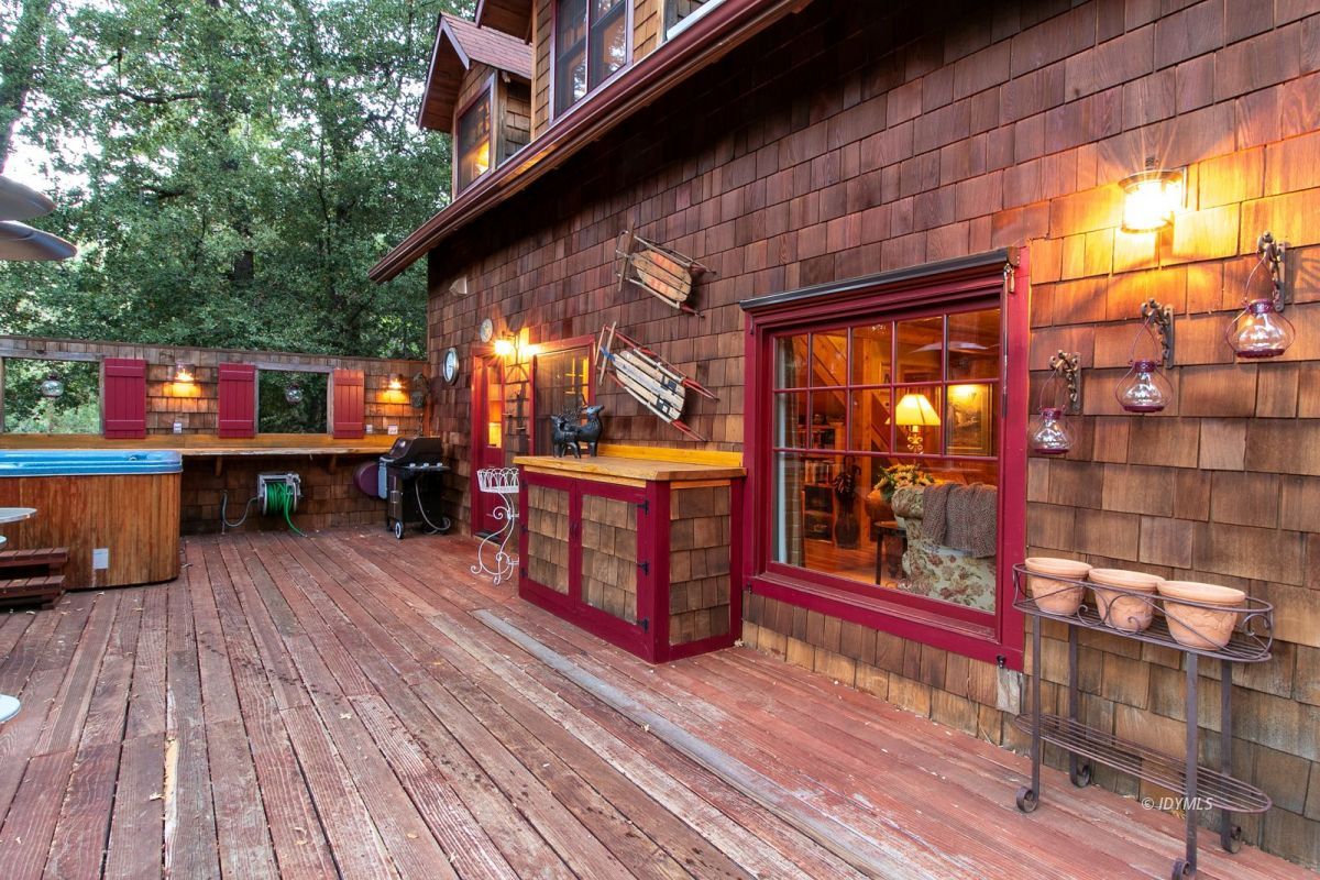 24715 Upper Rim Rock Road Idyllwild, CA 92549 - Photo 59 of 64 a view of a chairs and table in a patio