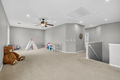 a view of a livingroom with furniture and a chandelier