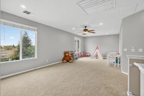 a bedroom with furniture and a chandelier