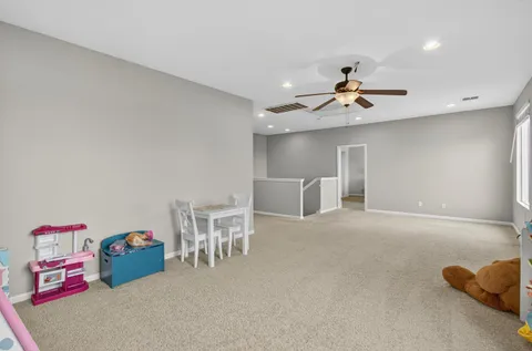 a bedroom with a large bed and a large window