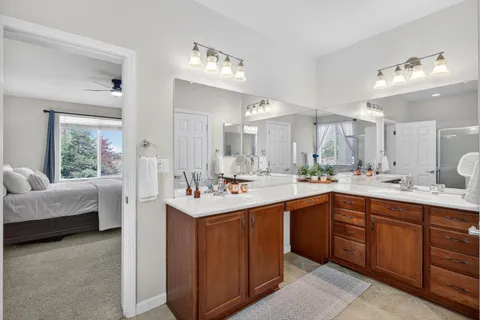 a bathroom with a bathtub shower and toilet