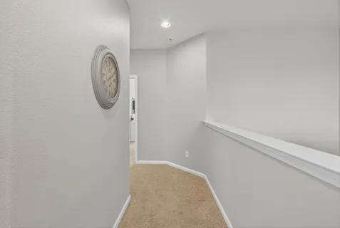 a view of a bathroom from a hallway