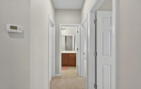 a room with a wooden floor and shoes