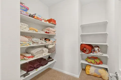 a bathroom with a sink vanity granite and toilet