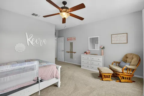 a white bath tub sitting next to a white wall