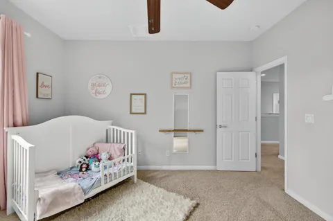 a view of walk in closet with clothes