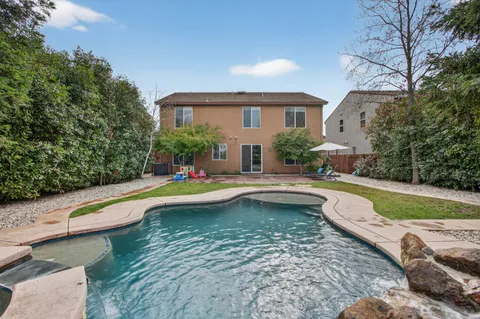 a aerial view of a house with garden space and street view